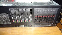 Figure 4. Normally the rack would be mounted right side up so the alignment of the hot swap drive buttons would be the same as the 3.5-in drives on the left but the rack has to be mounted upside down. Figure 4. Normally the rack would be mounted right side up so the alignment of the hot swap drive buttons would be the same as the 3.5-in drives on the left but the rack has to be mounted upside down.