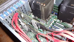 Figure 6. The MegaRAID 9361-8i board (right) was installed next to another LSI SAS controller (left) that was handling the 3.5-in hard drives. Figure 6. The MegaRAID 9361-8i board (right) was installed next to another LSI SAS controller (left) that was handling the 3.5-in hard drives.