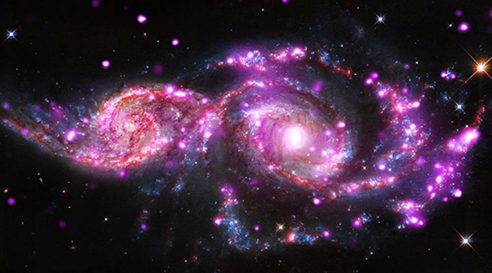This composite image of NGC 2207 and IC 2163 contains data from Chandra, NASA&apos;s Hubble Space Telescope and the Spitzer Space Telescope. (Image courtesy of NASA)