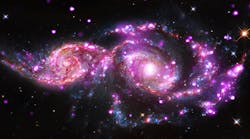 This composite image of NGC 2207 and IC 2163 contains data from Chandra, NASA&apos;s Hubble Space Telescope and the Spitzer Space Telescope. (Image courtesy of NASA)