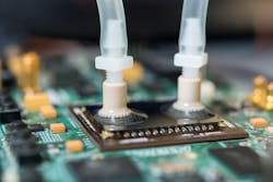 The researchers placed a silicon layer over microfluidic passages etched into the FPGA and ports were attached for water tubes which pumped deionized water over the chip Image courtesy of Rob Felt Georgia Tech The researchers placed a silicon layer over microfluidic passages etched into the FPGA and ports were attached for water tubes which pumped deionized water over the chip Image courtesy of Rob Felt Georgia Tech