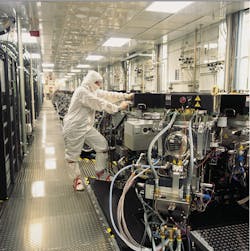 A Micron Technology worker checks semiconductor equipment in a maintenance corridor Image courtesy of Micron Technology A Micron Technology worker checks semiconductor equipment in a maintenance corridor Image courtesy of Micron Technology
