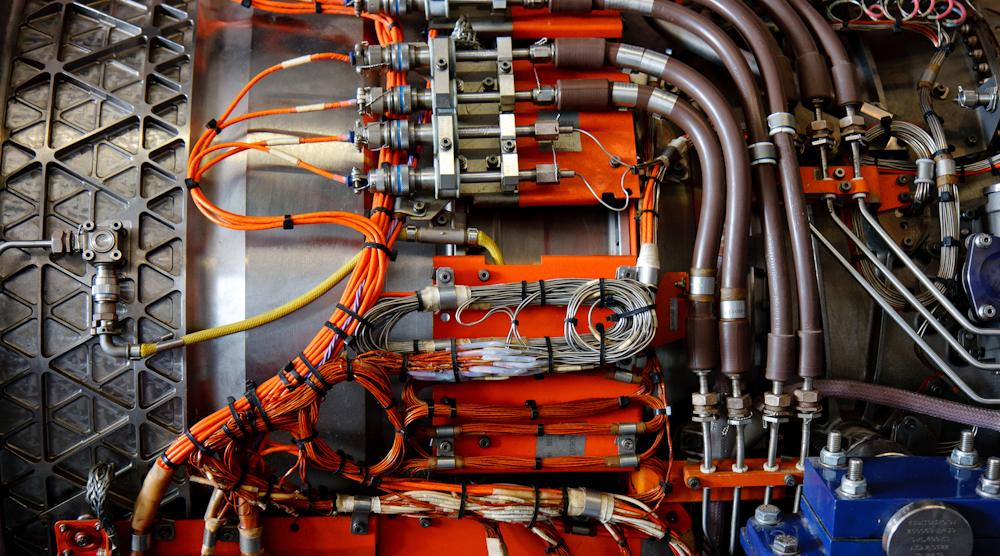 An array of sensors inside a jet engine. Data converters, like those built by Analog Devices, turn physical signals from sensors, like movement and pressure, into digital data. Linear Technology's power management chips help to conserve the electricity required for that process. (Image courtesy of Matt Gibson, Flickr). 喷气发动机内的传感器阵列。类似于模拟设备公司(Analog Devices)制造的数据转换器,将来自传感器的物理信号,如运动和压力,转换成数字数据。Linear technologies公司的电源管理芯片有助于节省这一过程所需的电力。(图片由Matt Gibson提供,Flickr)。