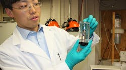 Guangsheng Zhang, a research associate at Penn State, holds a punctured lithium-ion battery. With growing safety concerns, researchers are developing batteries with thermal sensors that act like fail-safes. (Image courtesy of Penn State).