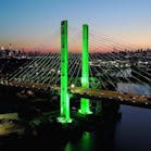 New York&rsquo;s Kosciuszko Bridge shines green as a symbol of solidarity among states and organizations protesting U.S. withdrawal from the Paris Agreement.