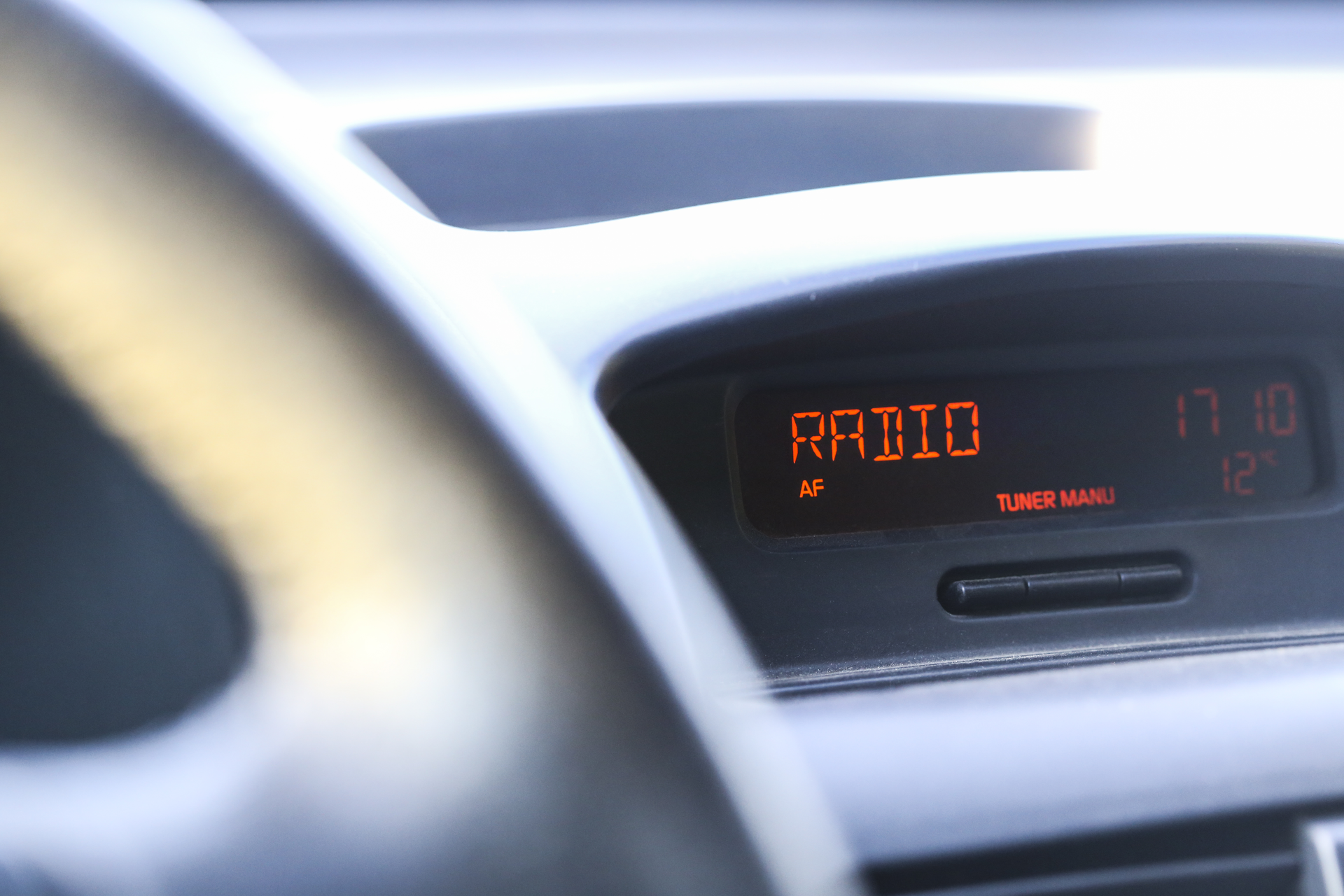 Closeup of car dashboard display with word radio