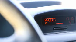 Closeup of car dashboard display with word radio