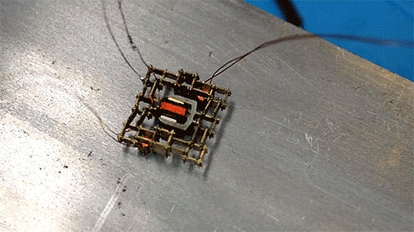 1. This walking microrobot was built by the MIT team from a set of just five basic parts, including a coil, a magnet, and stiff and flexible structural pieces. (Image by Will Langford/MIT)