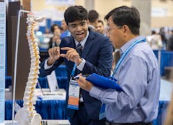 2. Krithik Ramesh received the Gordon E. Moore Award for his project that combined augmented reality, machine learning, and computer vision to help orthopedic surgeons achieve greater accuracy for screw placement during spinal surgery. (Credit: Chris Ayers/Society for Science & the Public) 2. Krithik Ramesh received the Gordon E. Moore Award for his project that combined augmented reality, machine learning, and computer vision to help orthopedic surgeons achieve greater accuracy for screw placement during spinal surgery. (Credit: Chris Ayers/Society for Science & the Public)