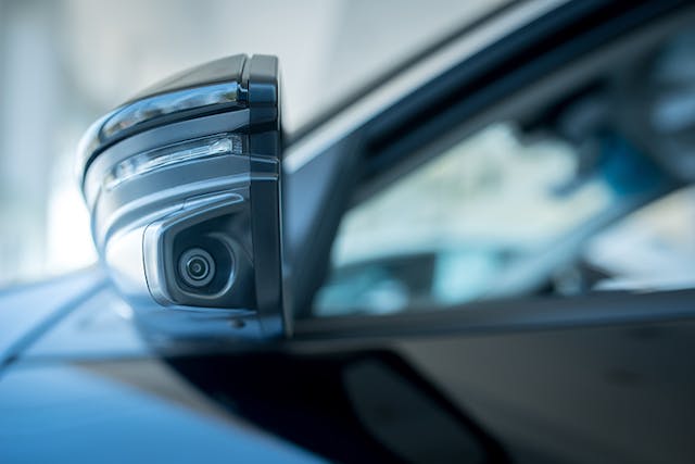 2. Since the camera on this car&rsquo;s left-side mirror plays a critical role in detecting blind spots, it&rsquo;s important to protect the camera from being compromised. Secure authentication can help here. (Courtesy of Bell Ka Pang/Shutterstock).