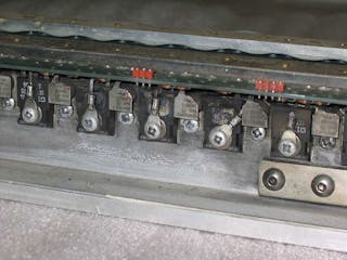 5. This electric-car motor controller prototype uses the busbars as heat sinks. This one was damaged by overcurrent on the FET source connections, which have melted. (Courtesy of Otmar Ebenhoech)