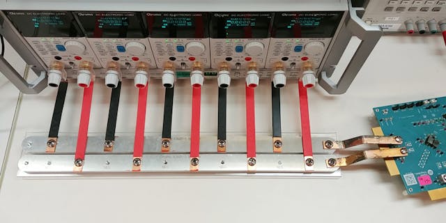 2. Shown is a parallel array of benchtop electronic loads with bus bar connections to an evaluation kit.