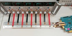 2. Shown is a parallel array of benchtop electronic loads with bus bar connections to an evaluation kit. 2. Shown is a parallel array of benchtop electronic loads with bus bar connections to an evaluation kit.