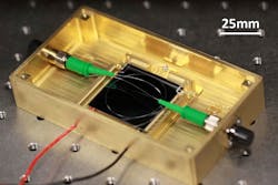 3. This is a photograph of a 36-mm-diameter silica resonator ring laser gyroscope packaged in a brass module with a thermoelectric cooler and fiber connectors. (Source: Caltech)