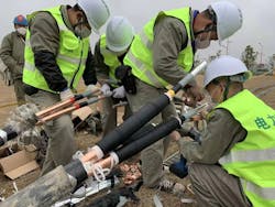Workers install the electrical system at the Huoshenshan Hospital in Hunan Province, China. The hospital was constructed in just 10 days to meet the needs of the province, which was the first global hotspot in the global pandemic. Workers install the electrical system at the Huoshenshan Hospital in Hunan Province, China. The hospital was constructed in just 10 days to meet the needs of the province, which was the first global hotspot in the global pandemic.