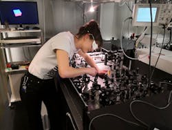 2. Researcher Claudia Gollner adjusts the optoelectronic setup in the lab at TU Wein&rsquo;s photonics institute. (Source: TU Wein)