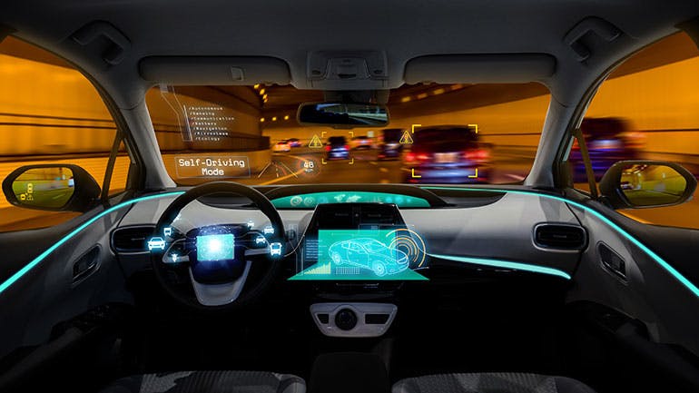 1. A futuristic ambient-lighting car concept shows a safety-related function integrated on the steering wheel.