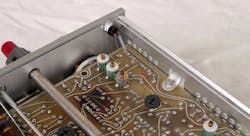 8. The pilot light mounts to the front panel. Note the burnt area in the foreground due to overheated resistors. 8. The pilot light mounts to the front panel. Note the burnt area in the foreground due to overheated resistors.