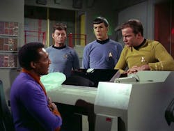 3. Doctor Richard Daystrom (left) talks to Dr. McCoy, Mr. Spock, and Captain Kirk about his M-5 computer (center) that has been programmed with Dr. Daystrom’s engrams. 3. Doctor Richard Daystrom (left) talks to Dr. McCoy, Mr. Spock, and Captain Kirk about his M-5 computer (center) that has been programmed with Dr. Daystrom’s engrams.