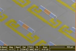 This electron microscope image shows an array of new chip components that combine the inductors (blue) and capacitors (yellow) needed to make electronic signal filters in phones and other wireless devices. This electron microscope image shows an array of new chip components that combine the inductors (blue) and capacitors (yellow) needed to make electronic signal filters in phones and other wireless devices.
