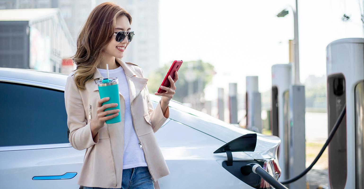 Woman Charging Electric Car 1540x800 5f45320b83114