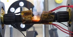 If a spark occurs, a polymer within the in-line connectors melts and a spring stretches out inside of it, widening the spark gap and stopping the flames, as shown in this image. If a spark occurs, a polymer within the in-line connectors melts and a spring stretches out inside of it, widening the spark gap and stopping the flames, as shown in this image.
