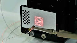 5. Using a non-surgical red laser, the steerability and repeatability of the beam is sketched on a flat surface in early trials. (Source: Wyss Institute/Harvard University) 5. Using a non-surgical red laser, the steerability and repeatability of the beam is sketched on a flat surface in early trials. (Source: Wyss Institute/Harvard University)