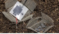 4. The capacitor disintegrated after two months buried in soil, leaving only a few visible carbon particles.