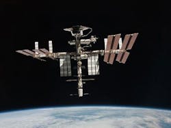 2. The Space Shuttle (top of image) docks with the ISS. (Image from Reference 2)