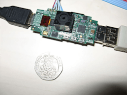 In 2011, the BBC showed a tiny prototype with an onboard camera and inline USB format. This USB dongle-style device never made it to market, but its spirit can certainly be felt in the Raspberry Pi Zero. In 2011, the BBC showed a tiny prototype with an onboard camera and inline USB format. This USB dongle-style device never made it to market, but its spirit can certainly be felt in the Raspberry Pi Zero.