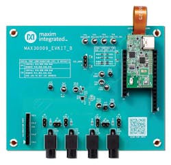 3. The associated MAX30009EVKIT# consists of a larger microcontroller board plus a smaller sensor board containing the MAX30009 (upper right corner) and on/off switch and status light, along with other components and connections including those for six supplied electrode cables.