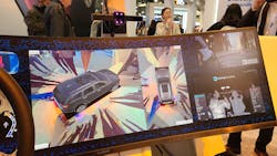 1. The large, curved display allows for multiple images to be displayed, such as the surround views (center) and simulated side-view cameras (top right). The eye and face tracking system is shown in the lower right. 1. The large, curved display allows for multiple images to be displayed, such as the surround views (center) and simulated side-view cameras (top right). The eye and face tracking system is shown in the lower right.