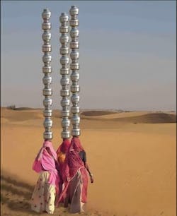 The image shows women collecting water, miles away from their home, during the long and hot summers in Adyar, India. The image shows women collecting water, miles away from their home, during the long and hot summers in Adyar, India.