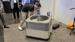 In the demo, Renesas employees wrapped an air-conditioning system to simulate an overheating condition that was recognized by the machine-learning application running on a Renesas microcontroller. In the demo, Renesas employees wrapped an air-conditioning system to simulate an overheating condition that was recognized by the machine-learning application running on a Renesas microcontroller.
