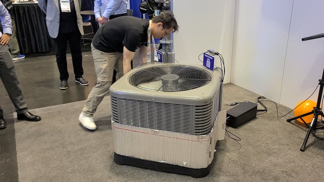 In the demo, Renesas employees wrapped an air-conditioning system to simulate an overheating condition that was recognized by the machine-learning application running on a Renesas microcontroller.