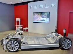 This image of a Tesla chassis and battery pack provides some idea of the space limitations in many EV applications as well as the large scale of battery packs&mdash;dual realities that shape current monitoring.