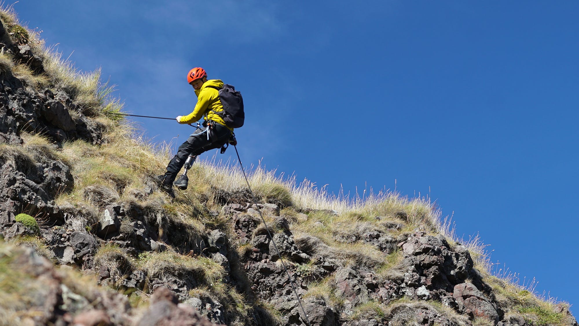 Albert Lin climbing a sea stack in Scotland, as the team searches for the lost city of the Picts.