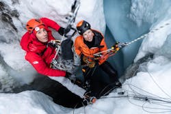 2. Before ascending, Alex Honnold and Heidi Sevestre descend into the ice to take water flow samples.