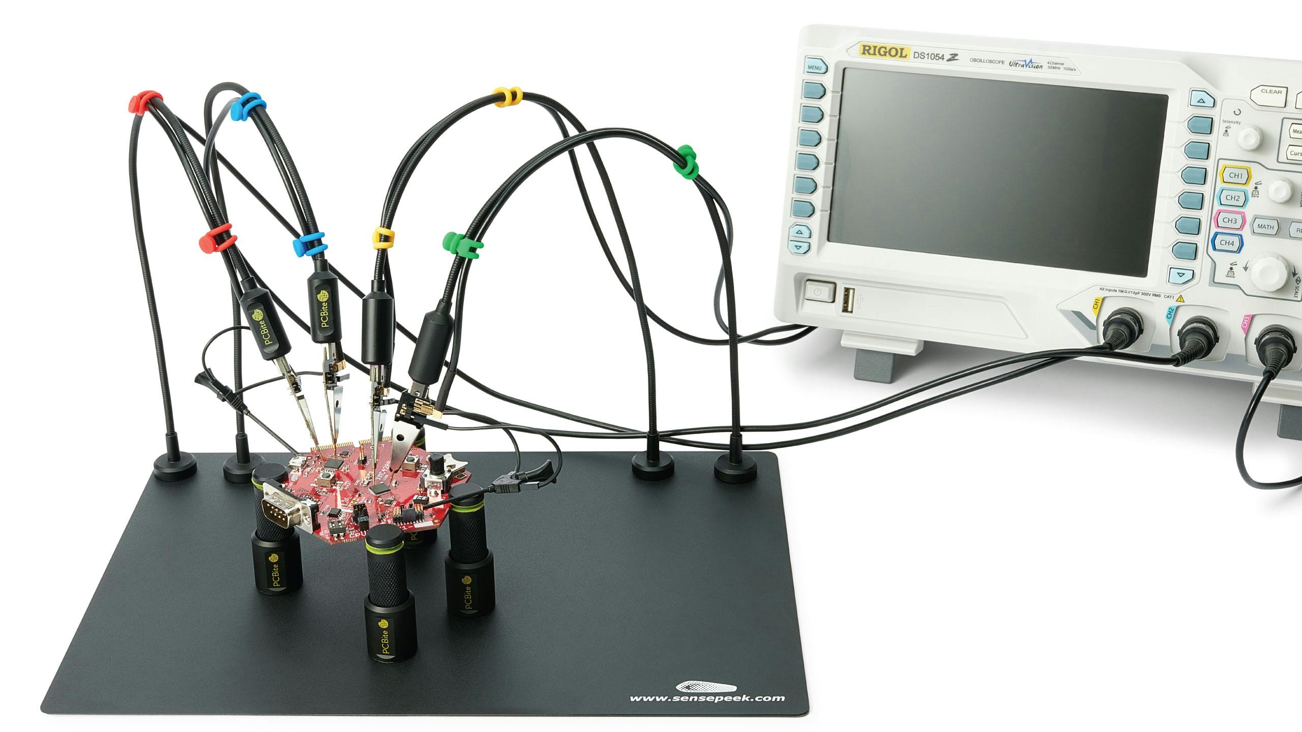 Sensepeek&rsquo;s PCBite consists of a metal base, spring-loaded magnetic standoffs, and arms to hold probes.