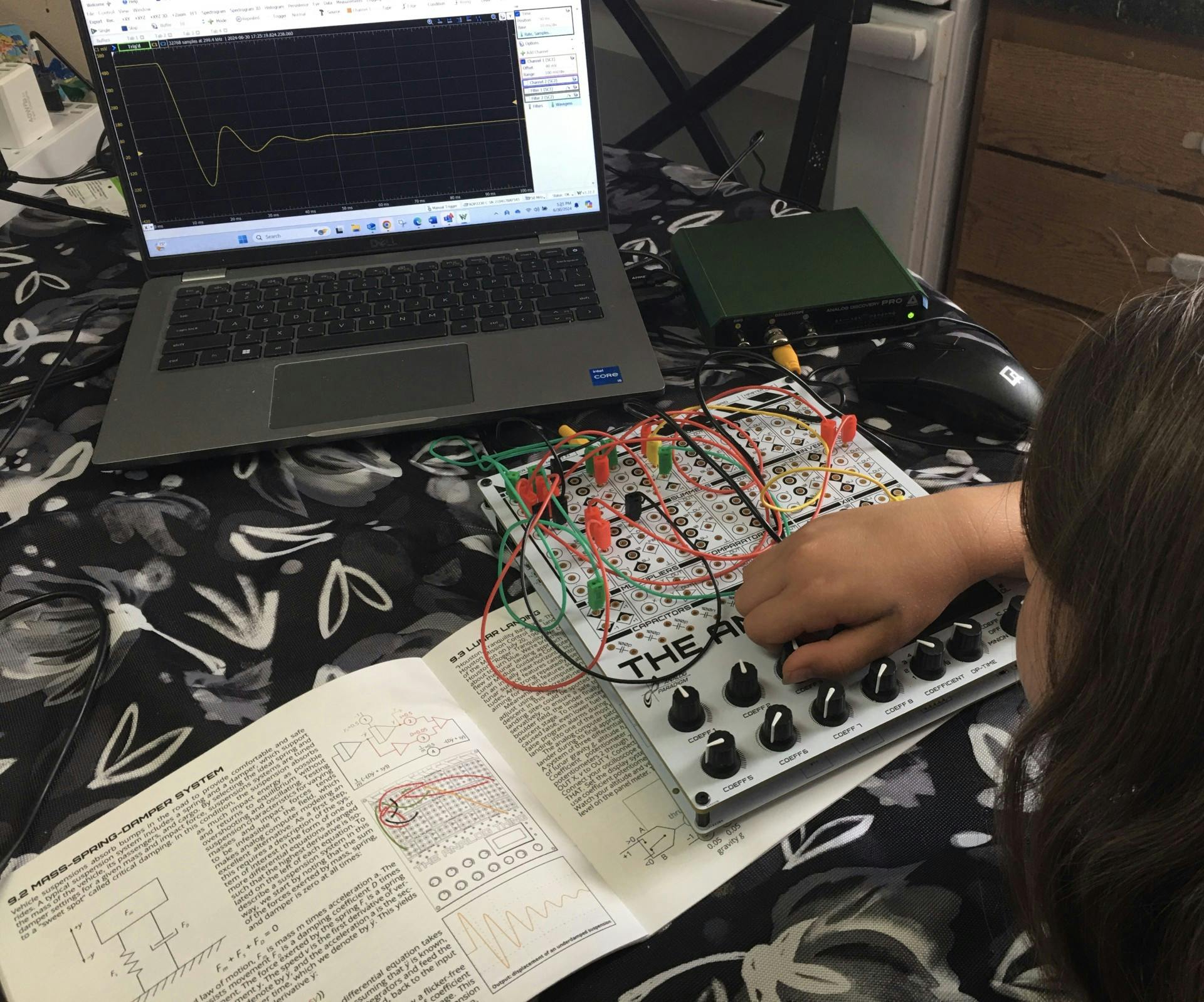 5. Analog Computation is running with all coefficients nominal and she's about to change the damping coefficient.