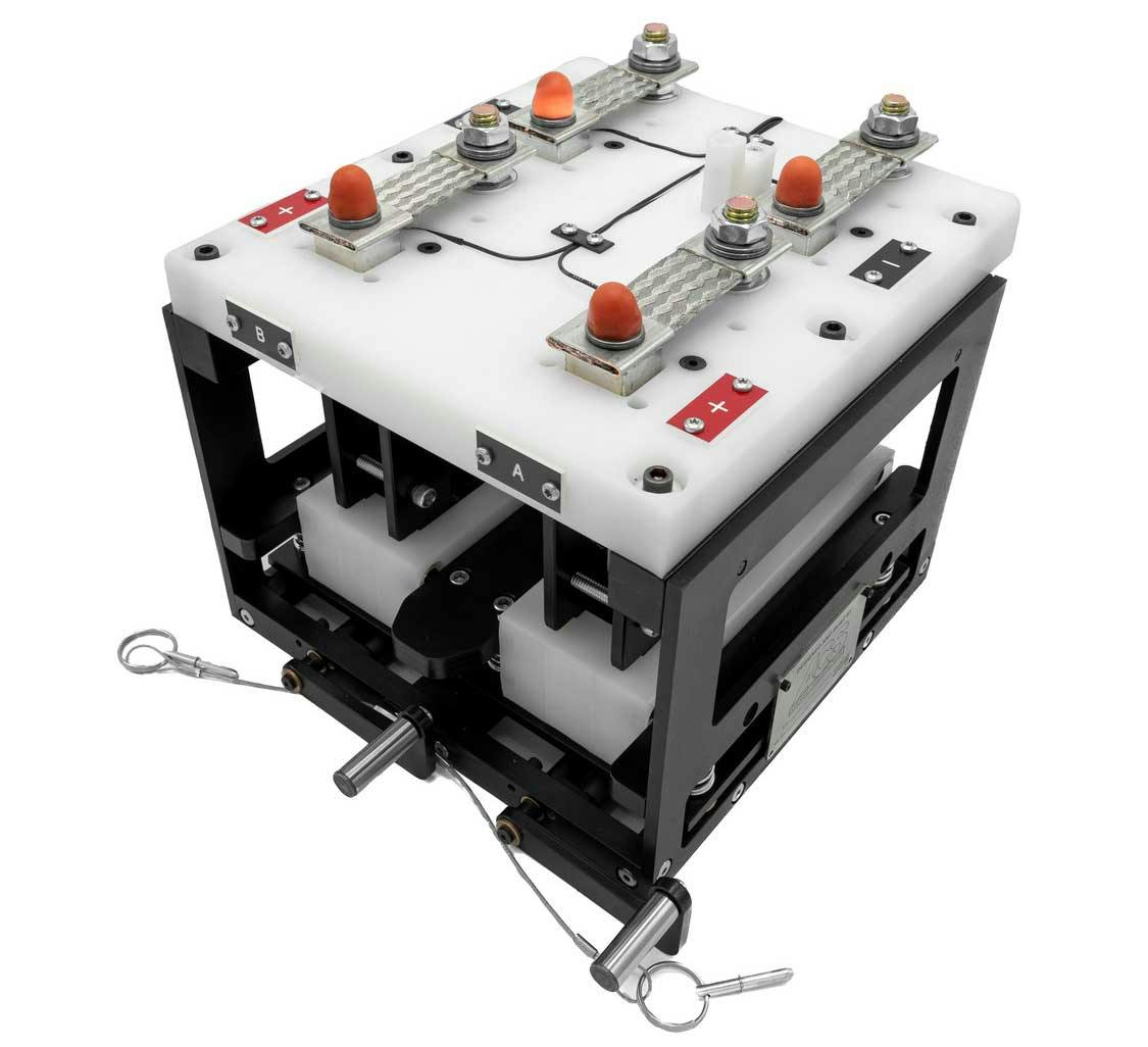 An electric battery quick connect fixture for testing and development is able to hold two batteries for concurrent testing.