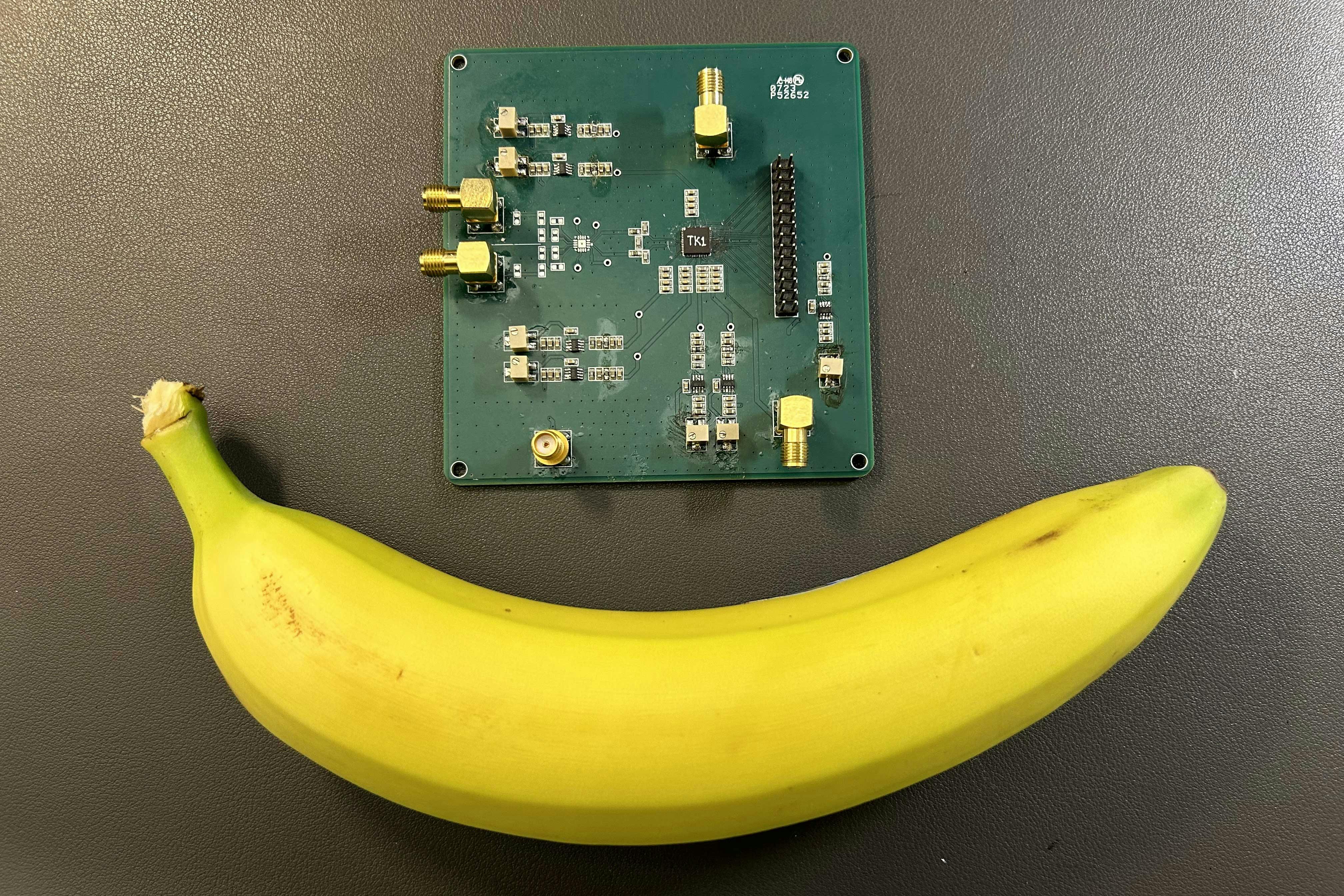 4. Surrogate packaged test chip as used by the first cohorts in September 2024 for design validation and test. Banana for scale.