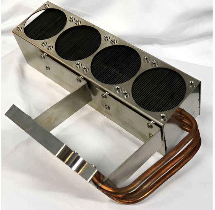 3. In a block-heat pipe-fin assembly, the heat pipes transport heat from electronics mounted on the block to a series of fins. Fans are then mounted onto the circular openings to supply air to cool the fins.