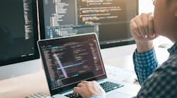 Programmer looking at software Programmer looking at software