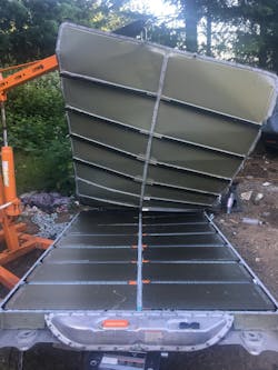 View of Burnie pack, from the rear, with the battery compartment lid peeled off View of Burnie pack, from the rear, with the battery compartment lid peeled off