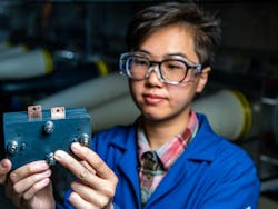 Ruozhu Feng, a battery researcher at PNNL, holds a prototype of a mini-flow cell. Ruozhu Feng, a battery researcher at PNNL, holds a prototype of a mini-flow cell.