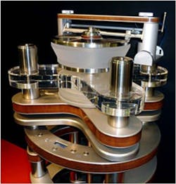 Figure 2. Mostly made up of wood and aluminum, the Clearaudio Statement turntable weighs 770 lb, features a microprocessor-controlled motor drive unit, and makes ample use of a 176lb. pendulum to keep its platters level. Figure 2. Mostly made up of wood and aluminum, the Clearaudio Statement turntable weighs 770 lb, features a microprocessor-controlled motor drive unit, and makes ample use of a 176lb. pendulum to keep its platters level.