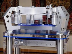 Figure 3. A unique mechanical design, the Basis Work of Art uses a mass-spring-dampener suspension system to isolate the turntable from its surroundings. Figure 3. A unique mechanical design, the Basis Work of Art uses a mass-spring-dampener suspension system to isolate the turntable from its surroundings.