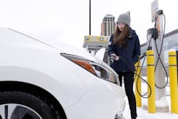 University of Michigan’s Engineering student Chloe Acosta plugs in an EV for charging in snowy weather University of Michigan’s Engineering student Chloe Acosta plugs in an EV for charging in snowy weather