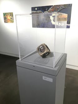 Bronze cube sculpture on exhibit at the Helzer Art Gallery Bronze cube sculpture on exhibit at the Helzer Art Gallery